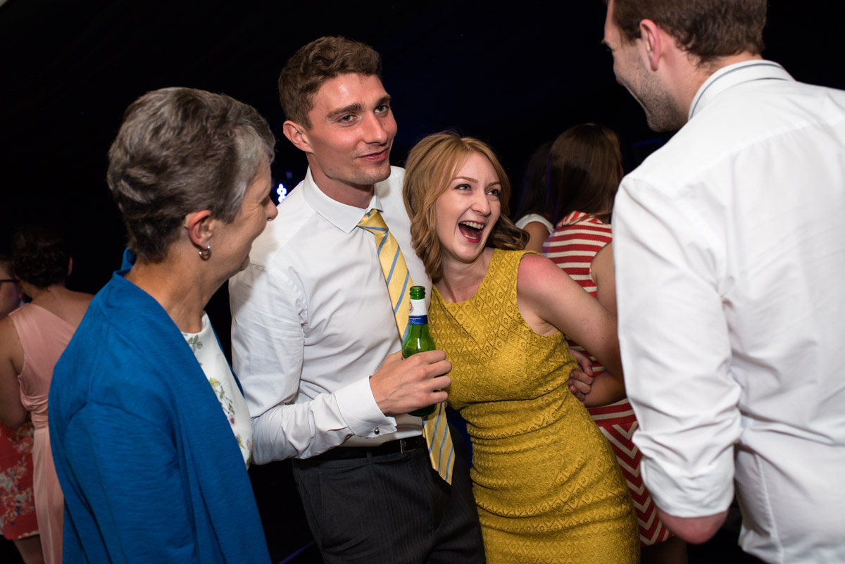 Paul and Lexy's wedding guests are photographed on the dance floor