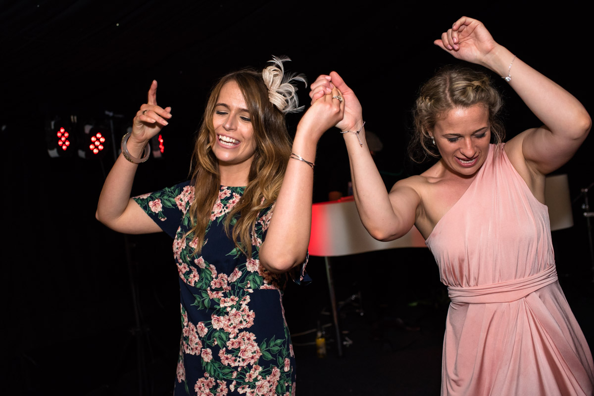 Lexy's bridesmaid has her photograph taken on the dance floor