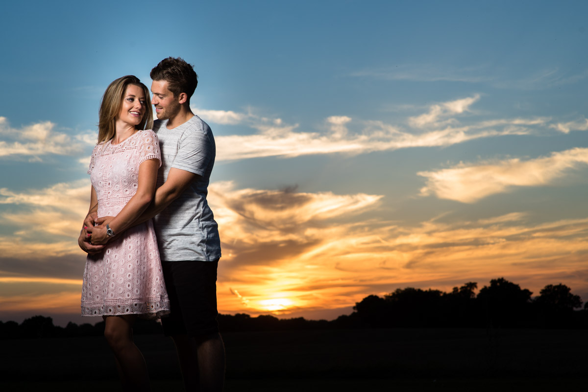 Off camera flash lit photograph of Jade and Stuarts pre wedding photoshoot at sunset in Kent