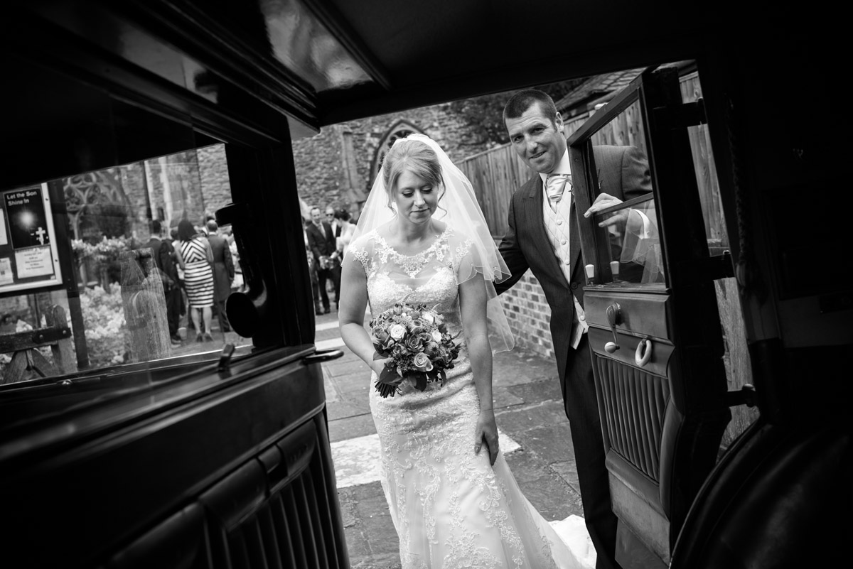 Becky is photographed getting into her wedding car