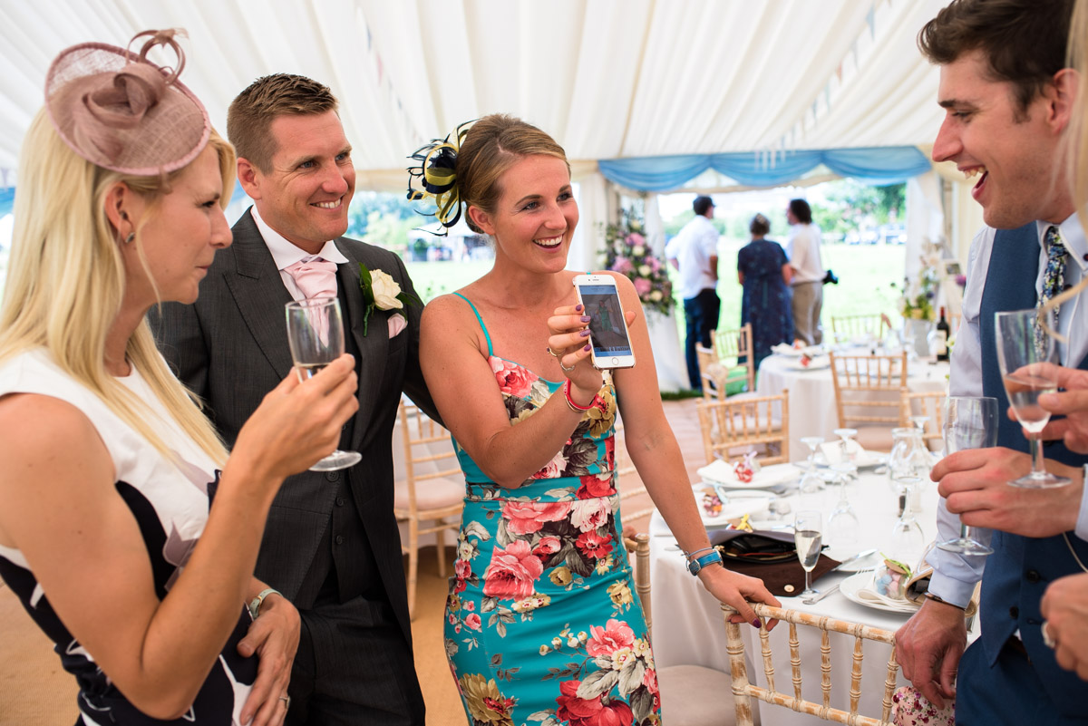 Wedding guests enjoy Kif and Becky's wedding reception in Marden, Kent
