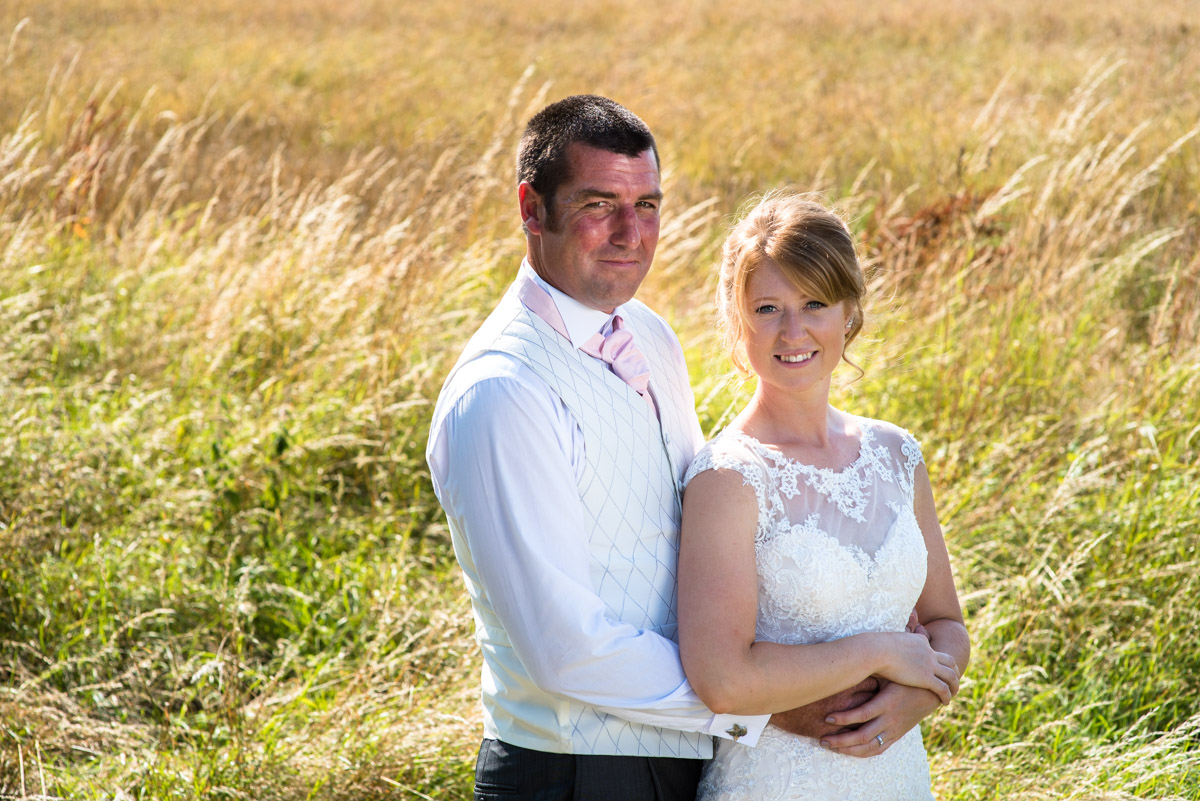 Wedding couple photograph of Kif and Becky in Kent farm fiields