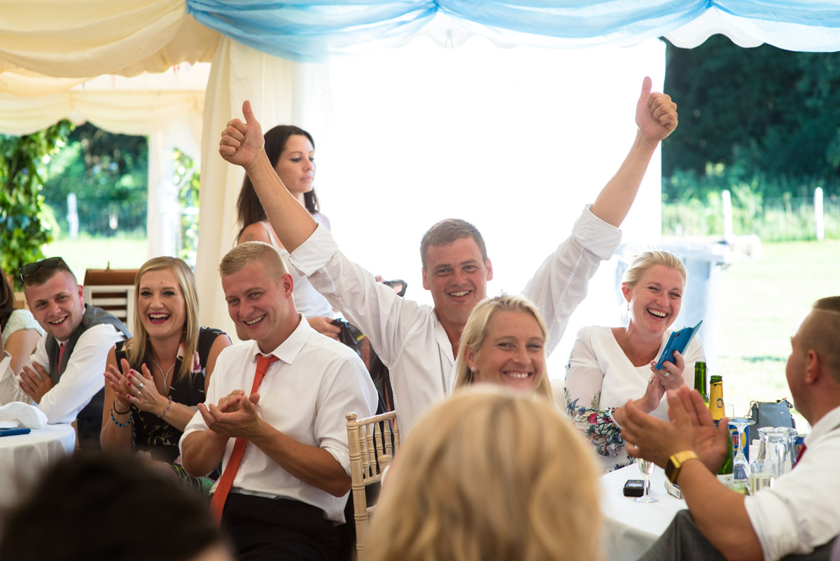 Photograph of Kif's usher during wedding speeches in marque in Kent