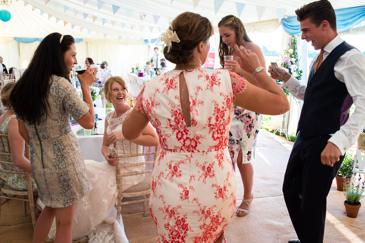 Photograph of wedding guests enjoying the reception with Becky in Marden Kent