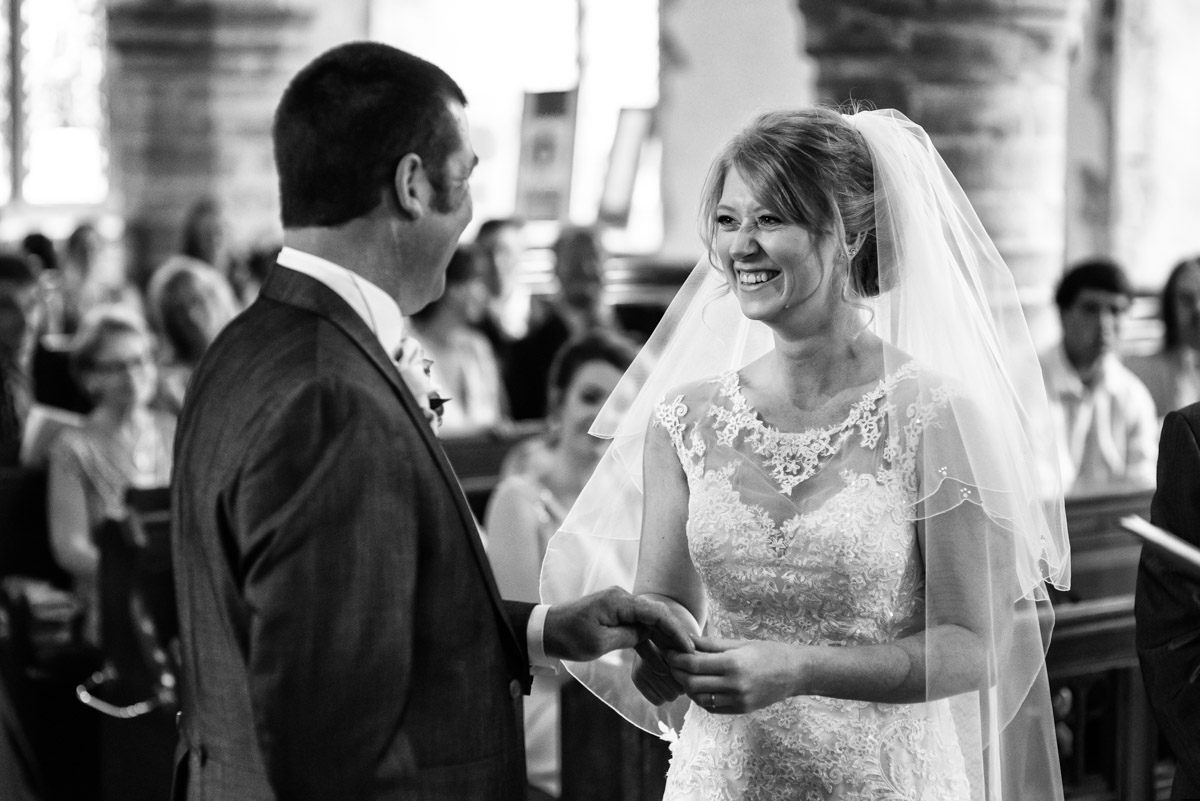 Photograph of Kif and Becky taking their wedding vows in Kent church
