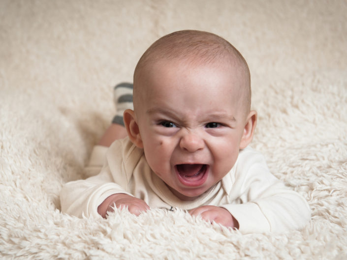 Photograph of baby boy lit by studio lights
