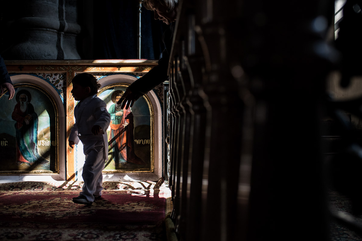photograph of little boy in armenian church during wedding