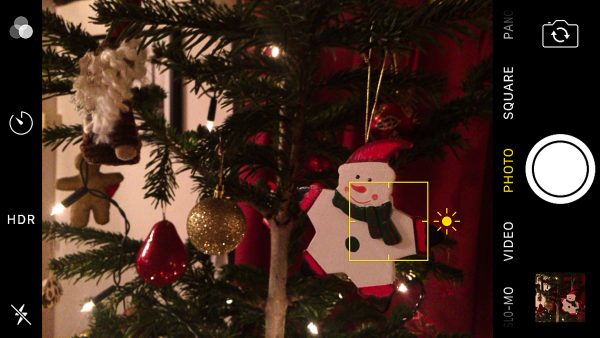 Photograph of christmas tree decoration with iPhone showing focus square