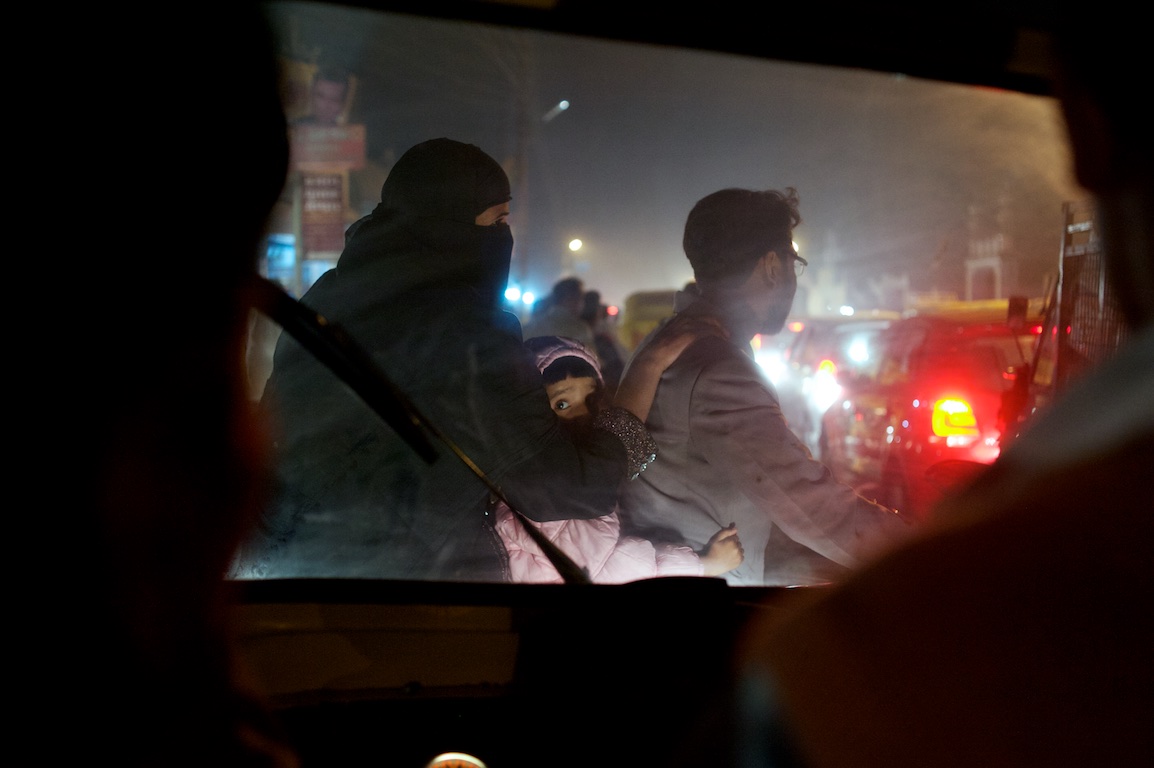 Photograph from rickshaw of passing traffic in varanasi