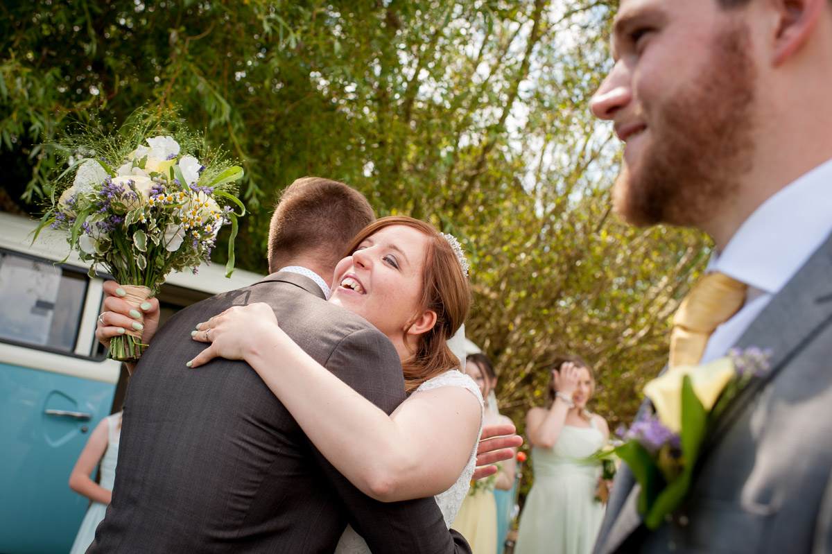 Amy and wedding guests photographed outside at The Secret garden in Kent