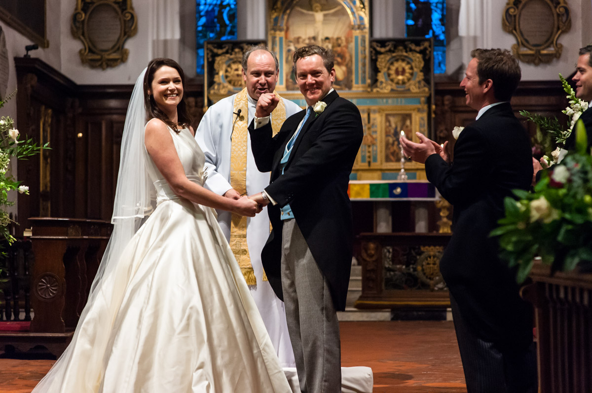 Photograph of Marcus celebrating being married to Frnaces after completion of their wedding ceremony