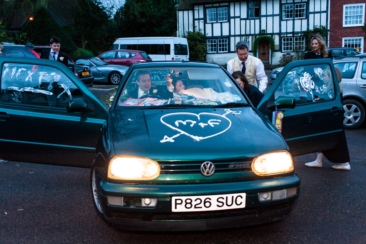Marcus and Frances leave for the wedding reception in his old golf car
