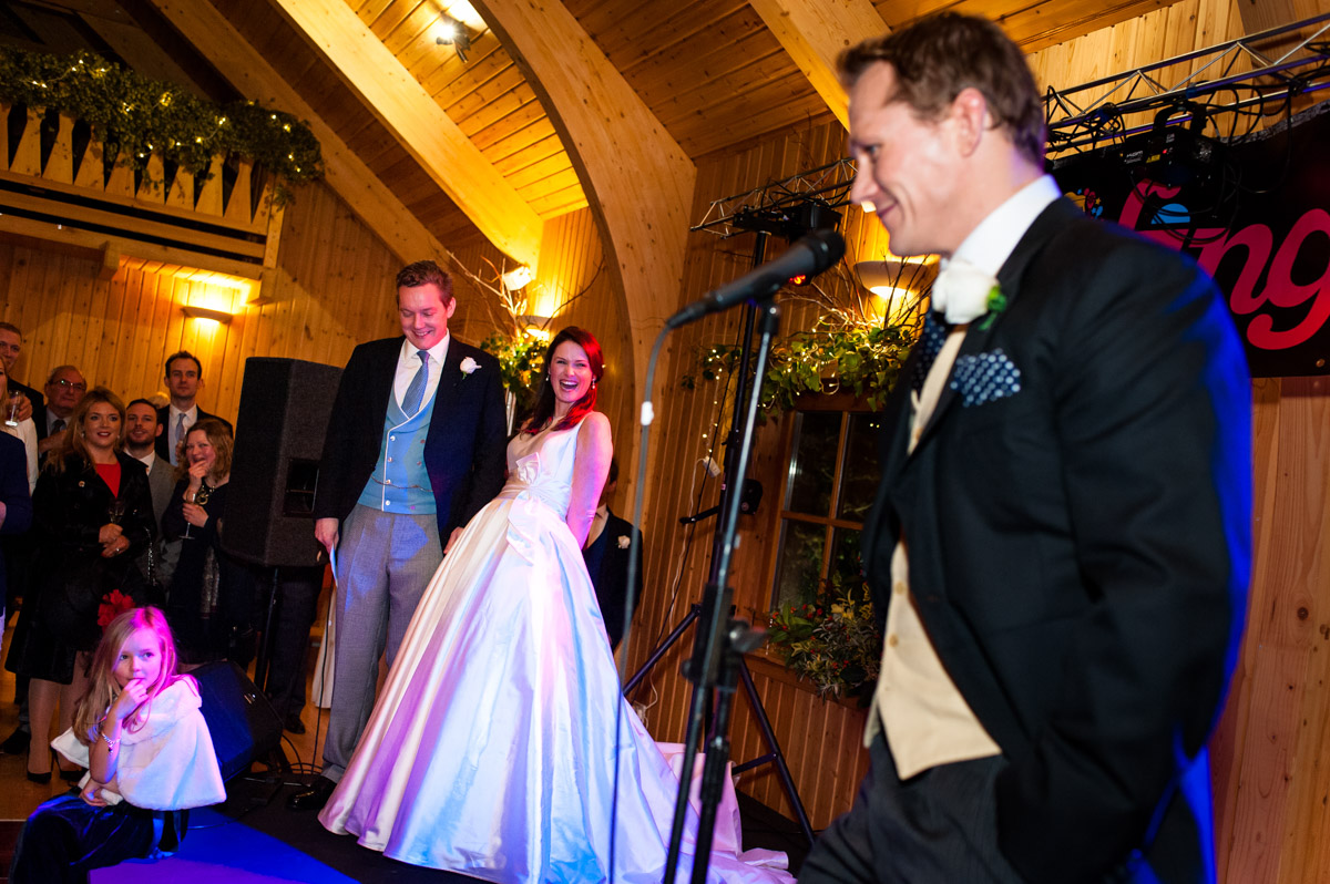 Frances laughs during best mans speech at their Kent wedding reception