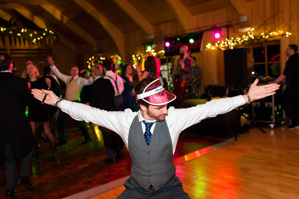 Photograph of wedding guests striking a pose at Marcus and Frances;'s reception