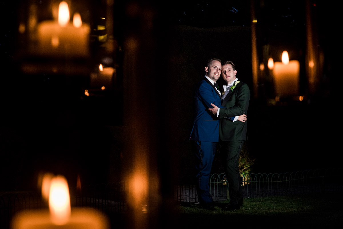 Flash lit portrait of david and simon photographed at their Kent wedding
