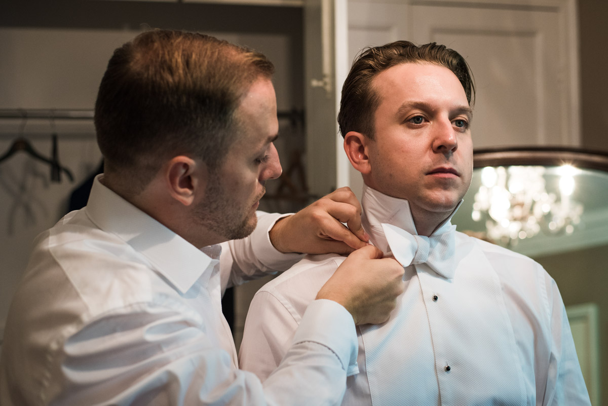 Simon helps David getting ready for their Kent wedding at Port Lympne Mansions