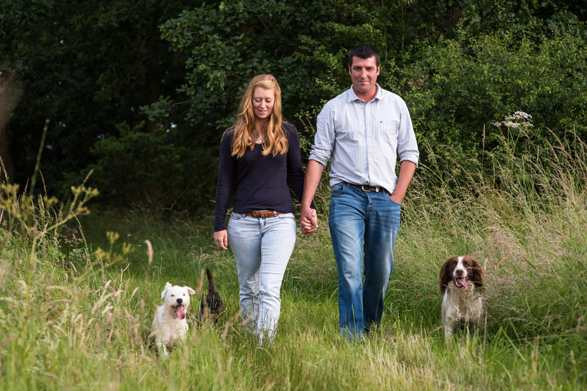 Kif and Becky enjoy a walk during their pre wedding photoshoot on their farm before their Kent wedding
