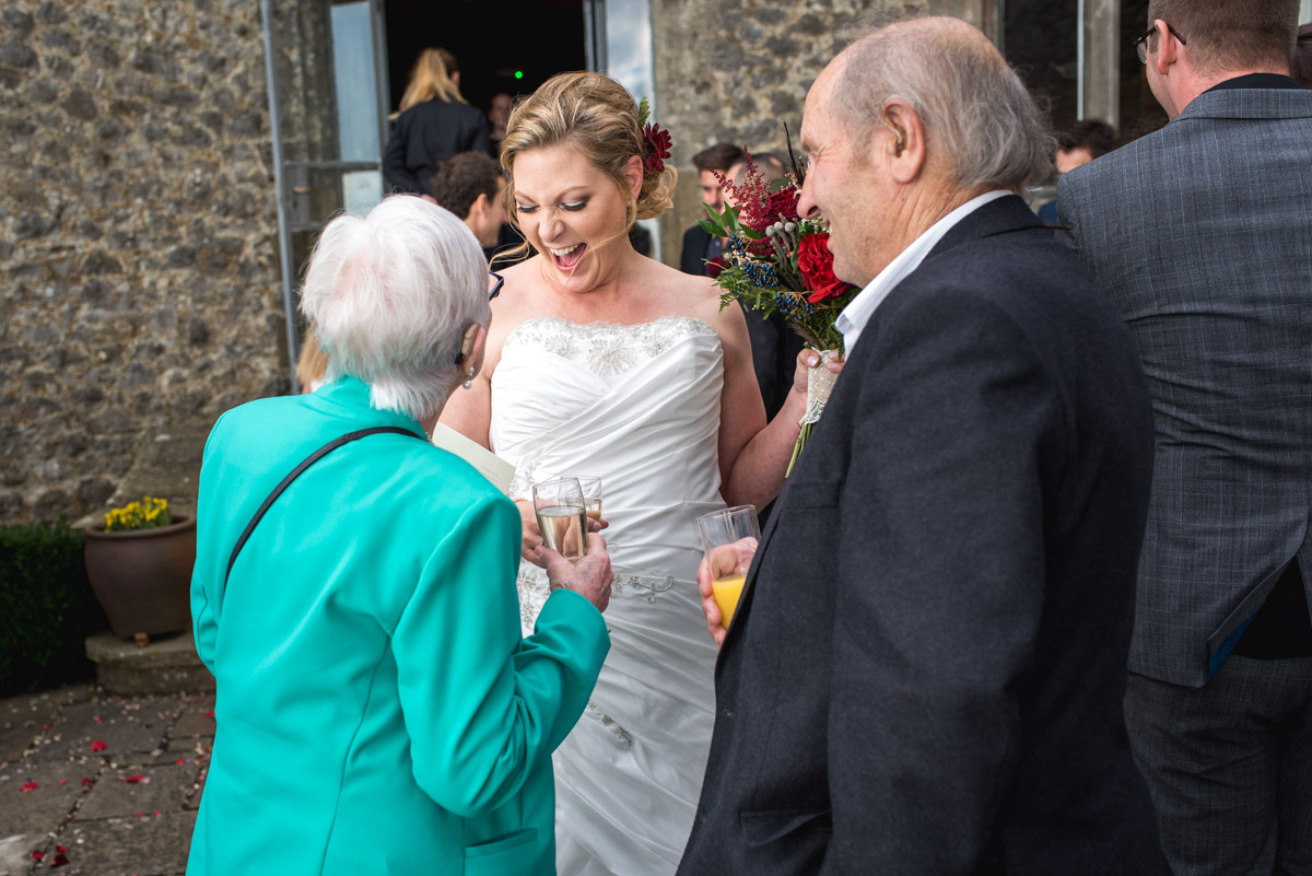 Lianne laughs with her gran after her wedding ceremony at Lympne Castle in kent
