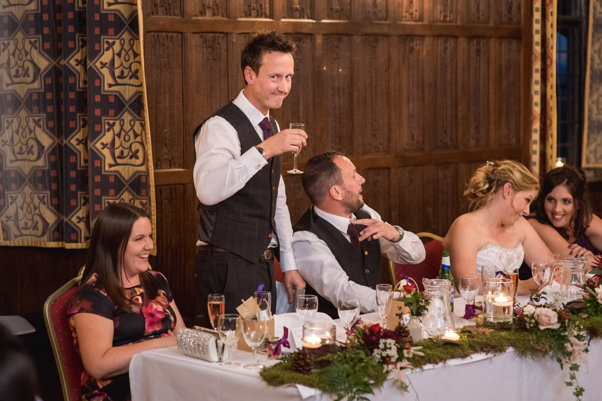 Johns best man makes his wedding speech during their reception at Lympne Castle in Kent
