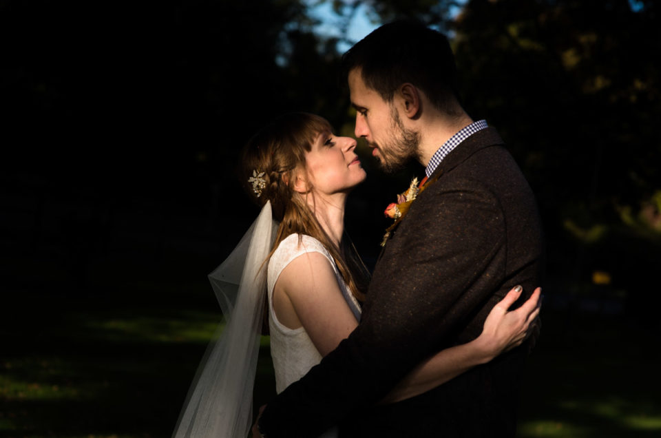 Photograph of Paul and Laura together lit by late afternoon sunshine on their wedding day