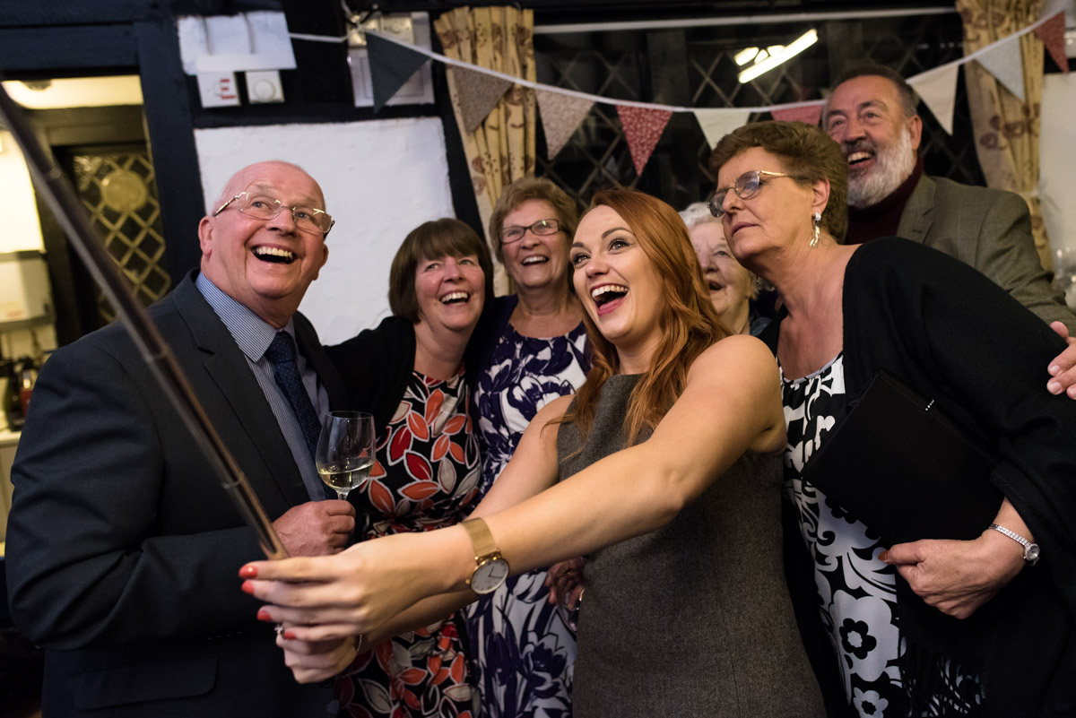 guests at Laura and Pauls kent wedding are photographed taking selfies