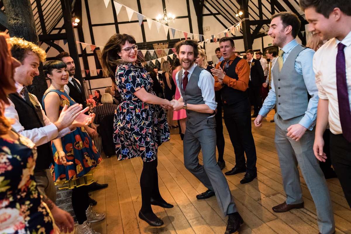 Photograph of wedding guests dancing at Laura and Pauls Kent wedding