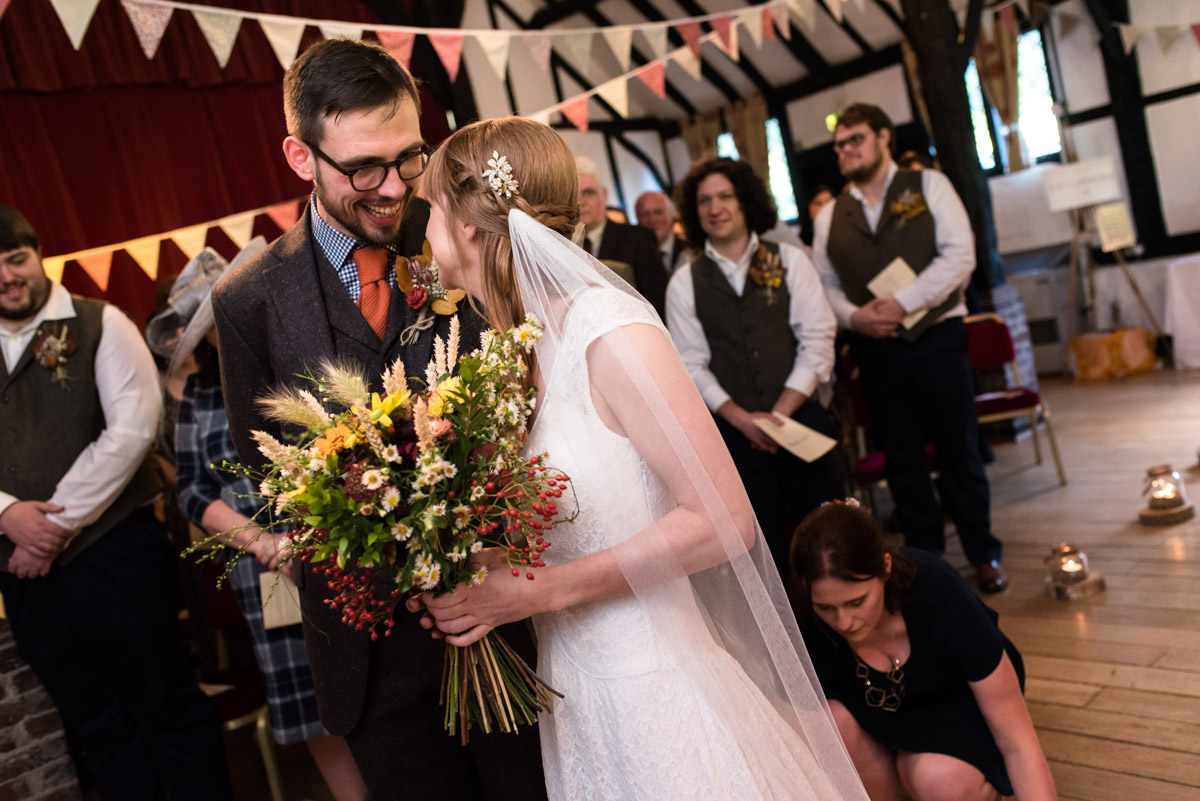 kent wedding photography at Chilham village Hall in Kent. Laura and Paul during their wedding ceremony.