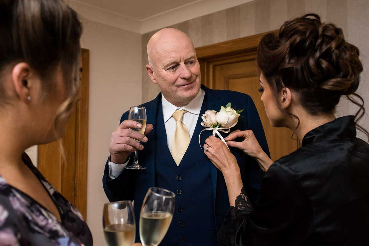 Jades father has his button hole attached