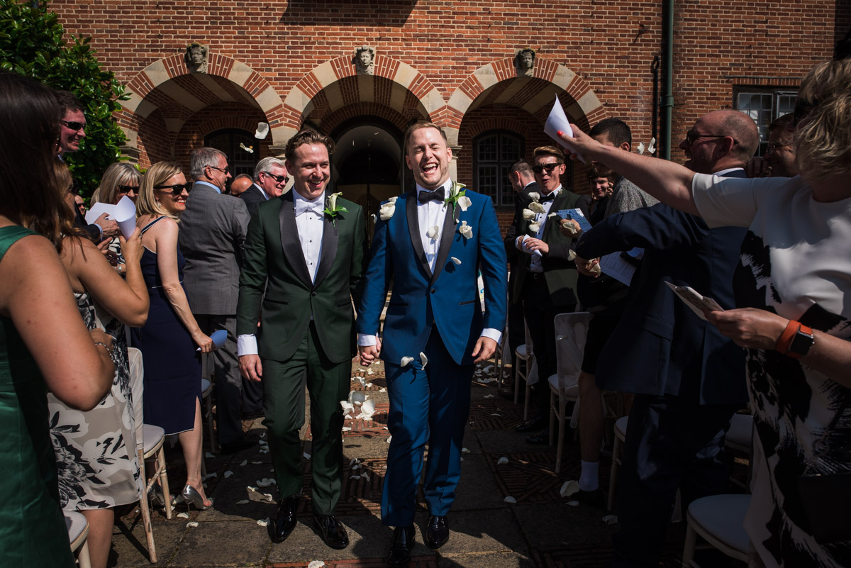 Confetti throw over Simon & david after their Kent wedding at Port Lympne