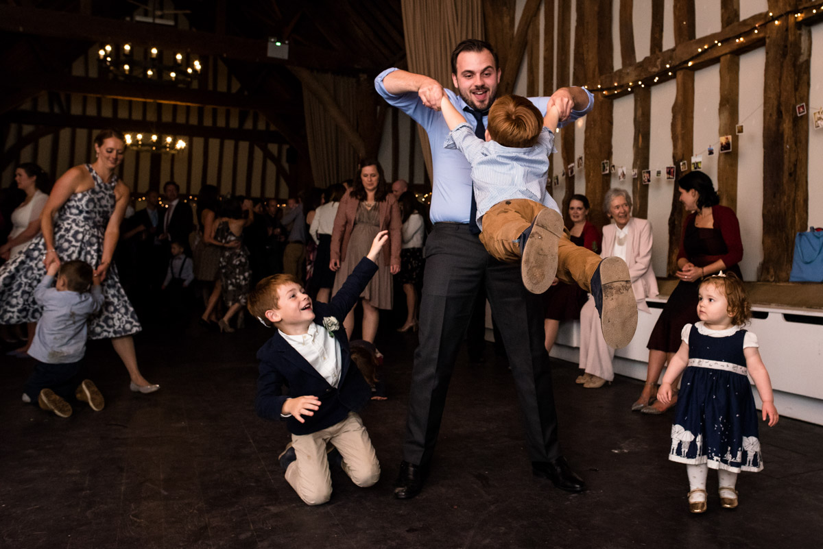Wedding guests and children enjoy dancing at Chris and Debbies wedding