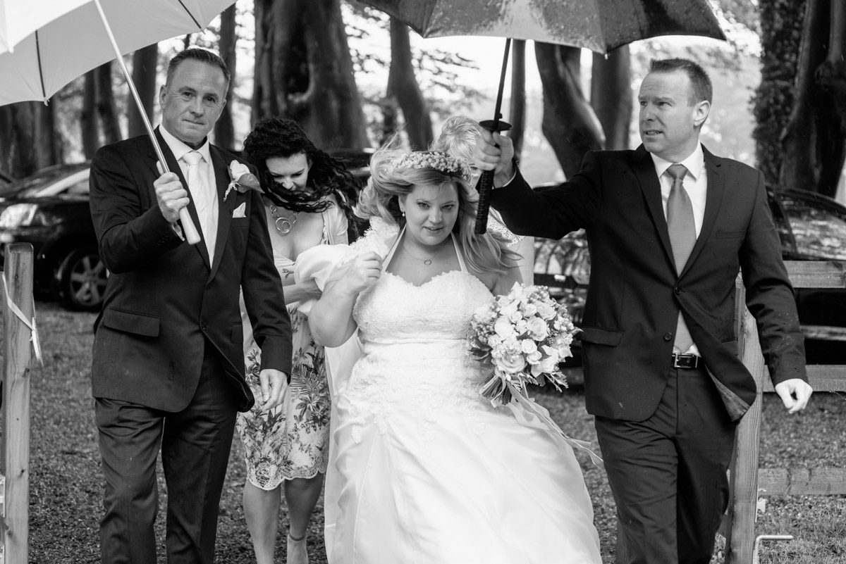 Lee arrives for her Kent wedding in the rain