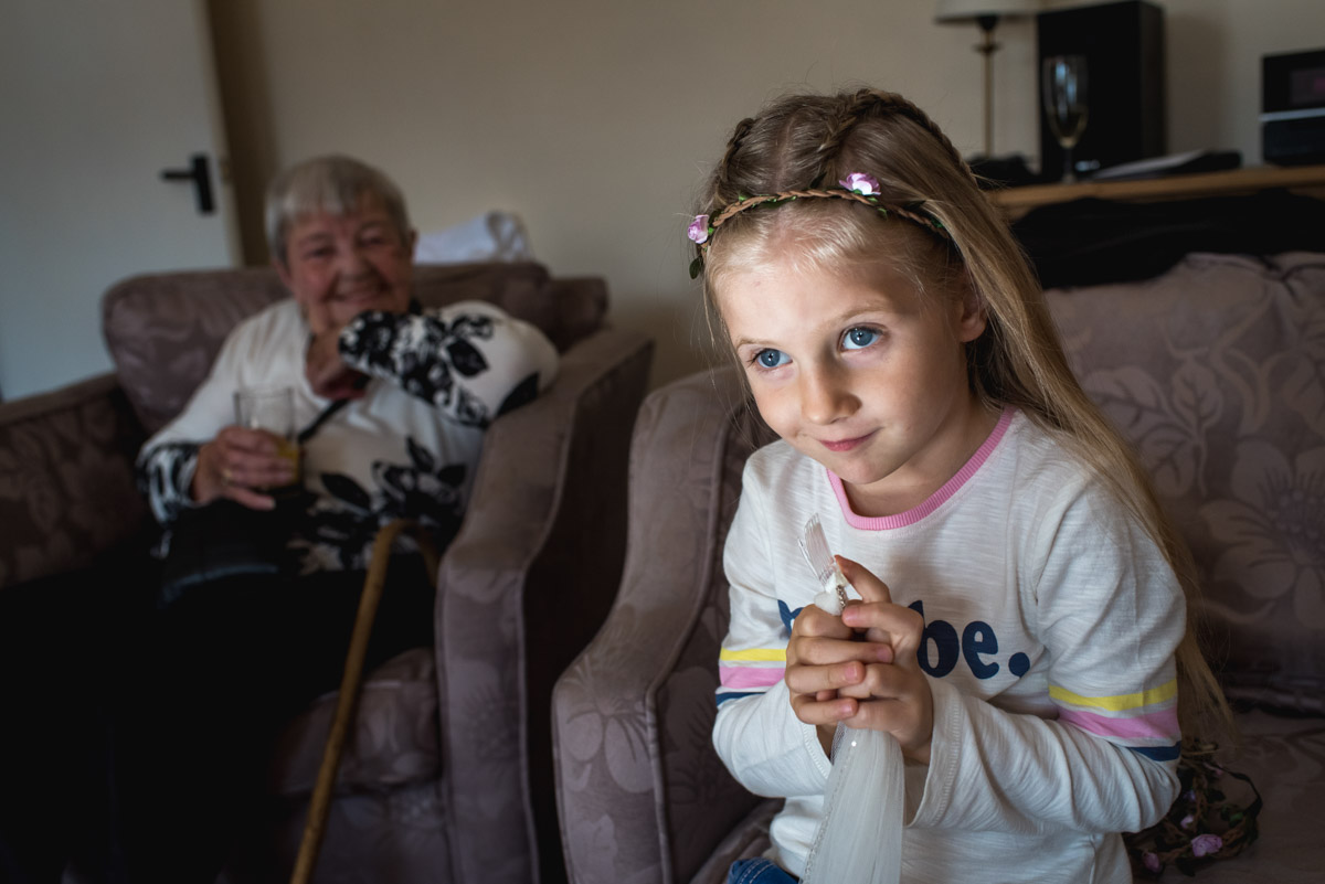 photograph of flower girl and gran getting ready for Lianne and Johns wedding in Kent