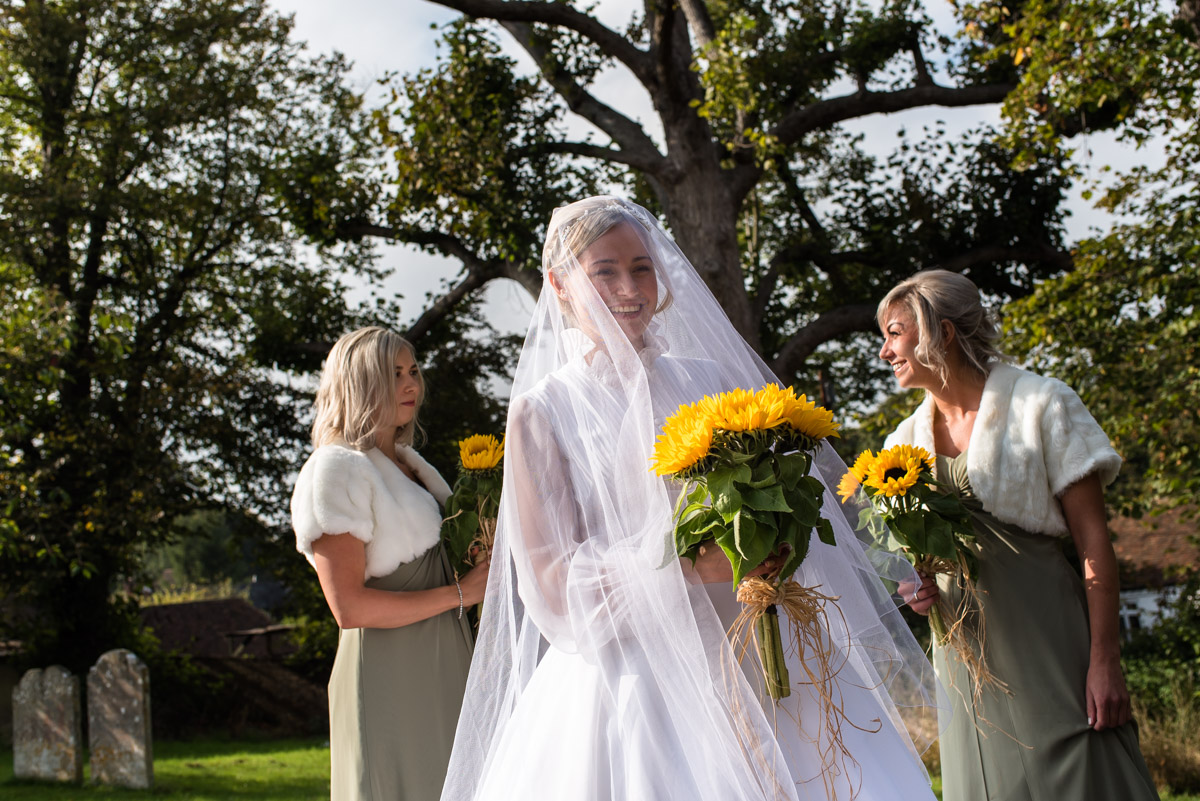 Photograph of Jane and her bridesmaids outside Kent church on her wedding day