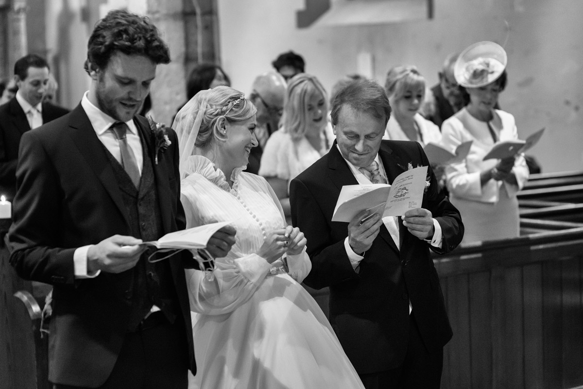 Black and white photograph of Steven, jane and her dad in church