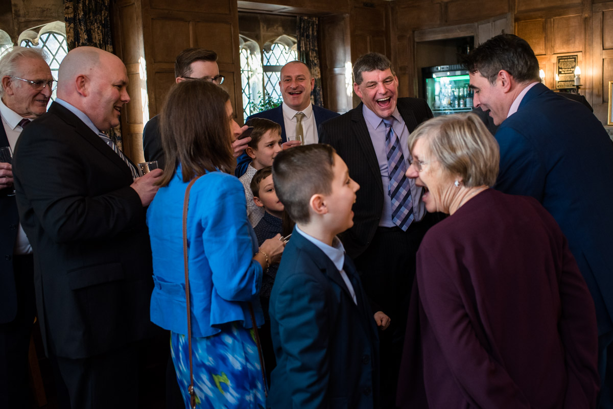 wedding guests at Sue and Nicks winter wedding enjoy magicians tricks