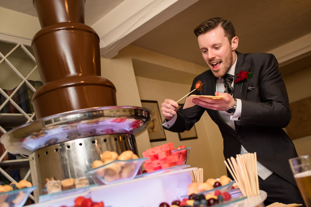 Enjoying the chocolate fountain at Sue and Nicks wedding reception