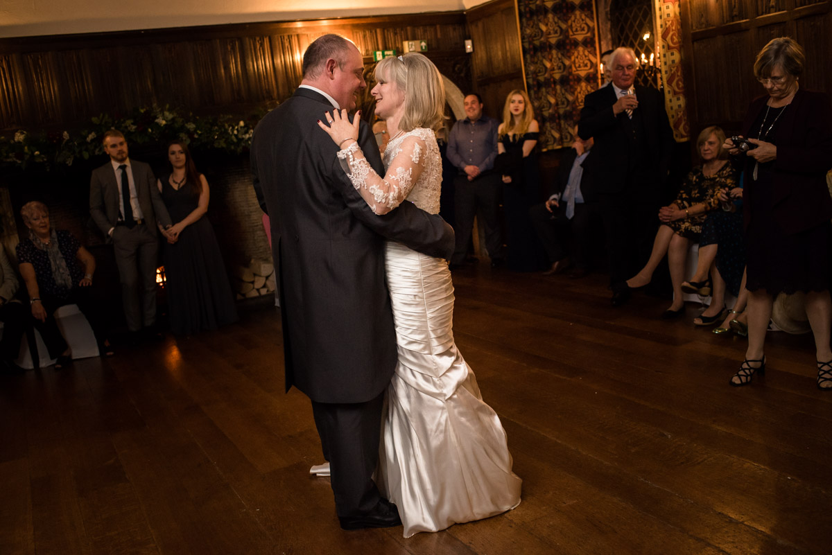 Nick and Sue are photographed doing their first dance at their wedding reception at Lympne castle in Kent
