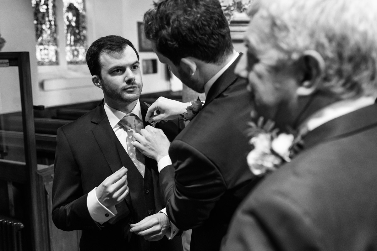 James has his wedding button hole arranged