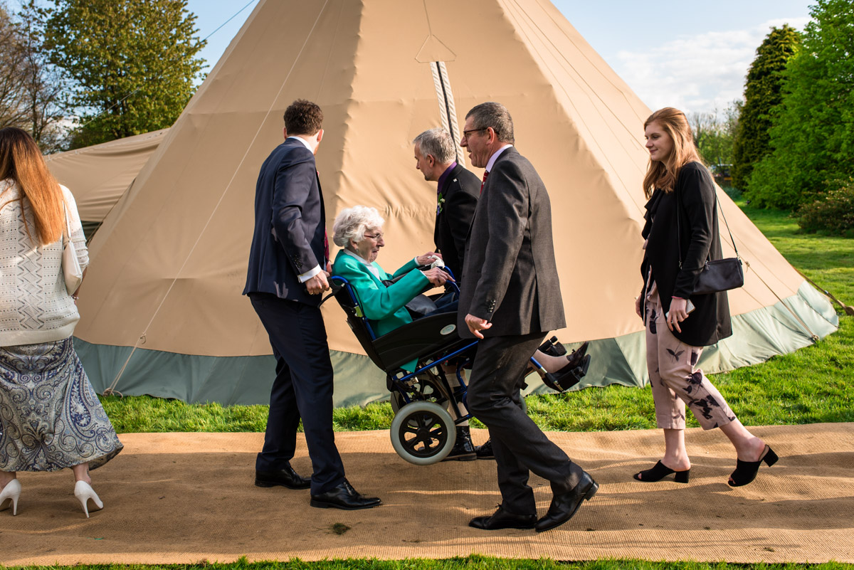 Photograph of gran being carried to wedding reception