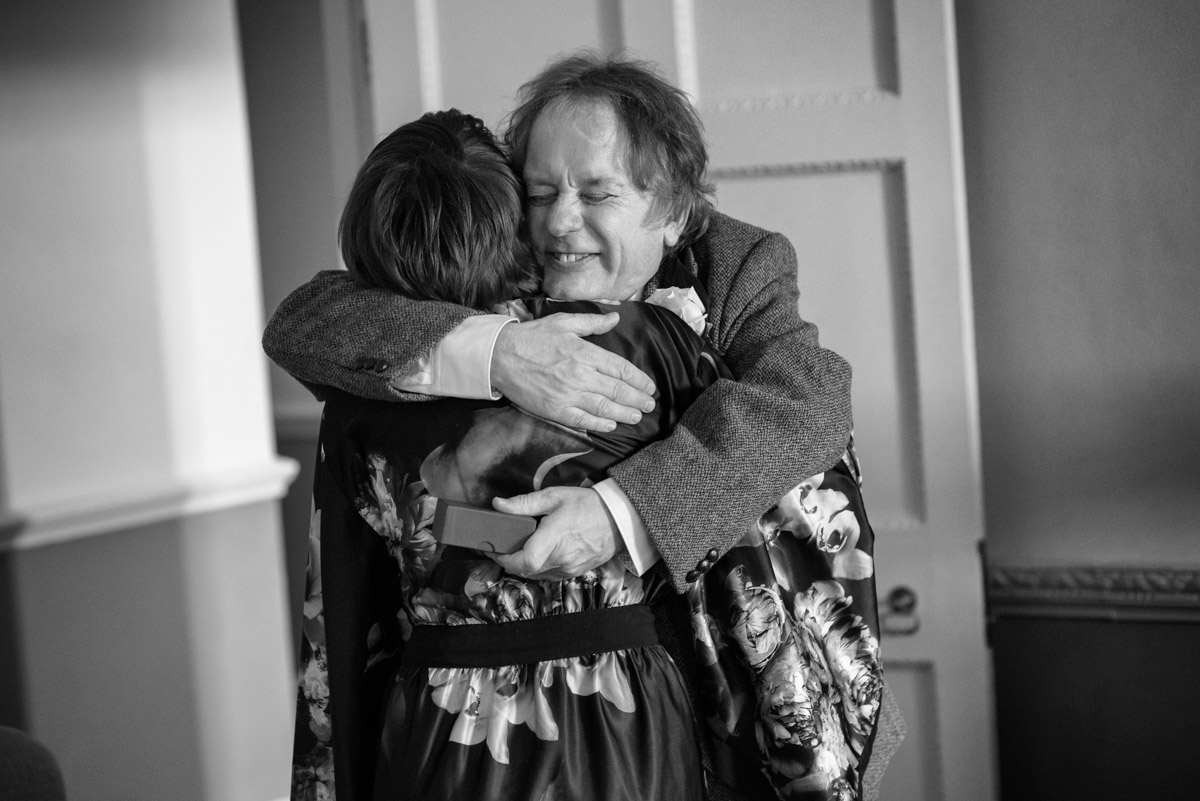 father embraced daughter on her wedding day at Buxted Park Hotel