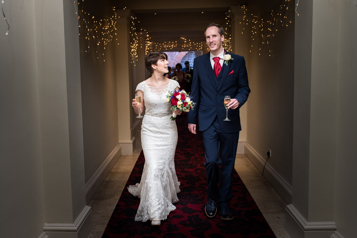 Joe and Bennet photographed after their wedding ceremony at Buxted Park Hotel