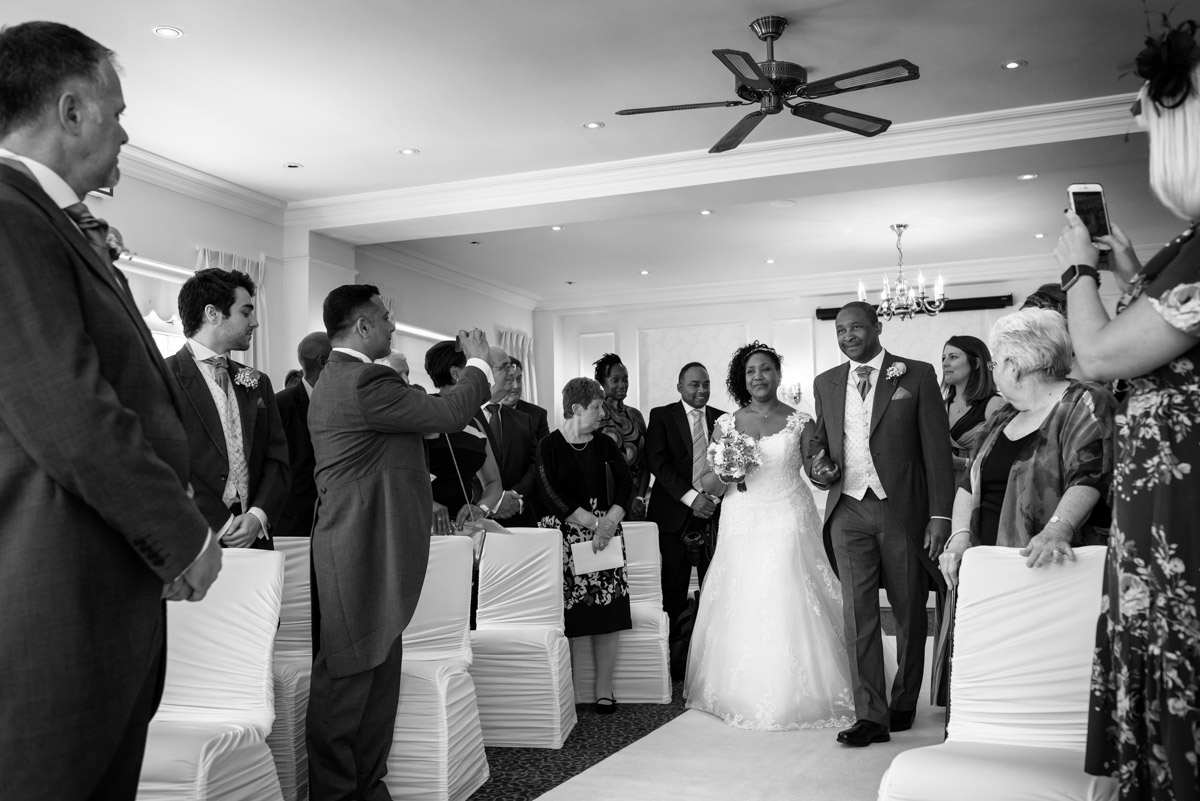 Juliette photographed escorted by her brother down the aisle