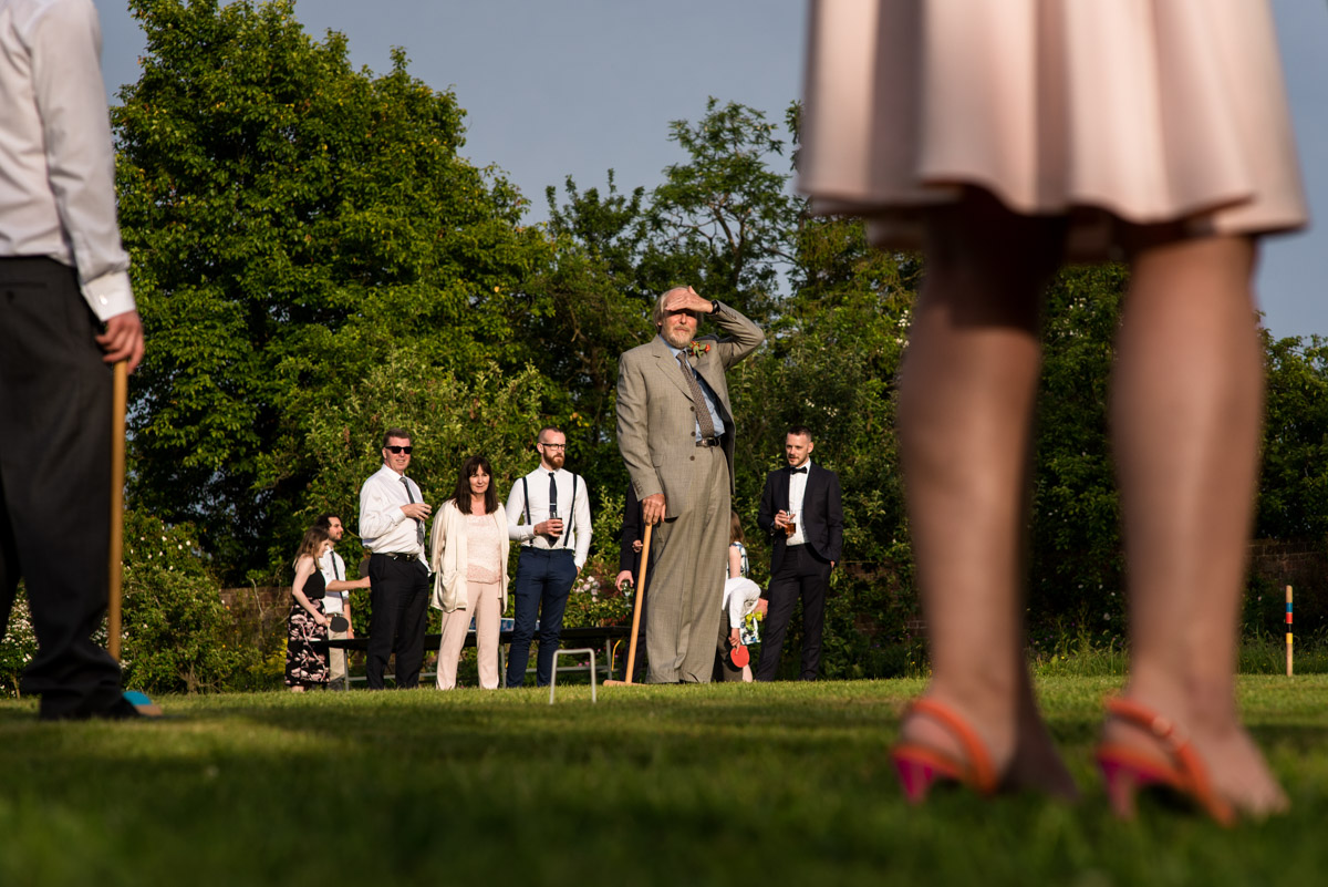 Wedding guests play croquet at Ratsbury Barn in Kent