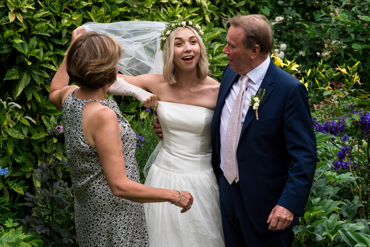 Group wedding photograph of bride and parents