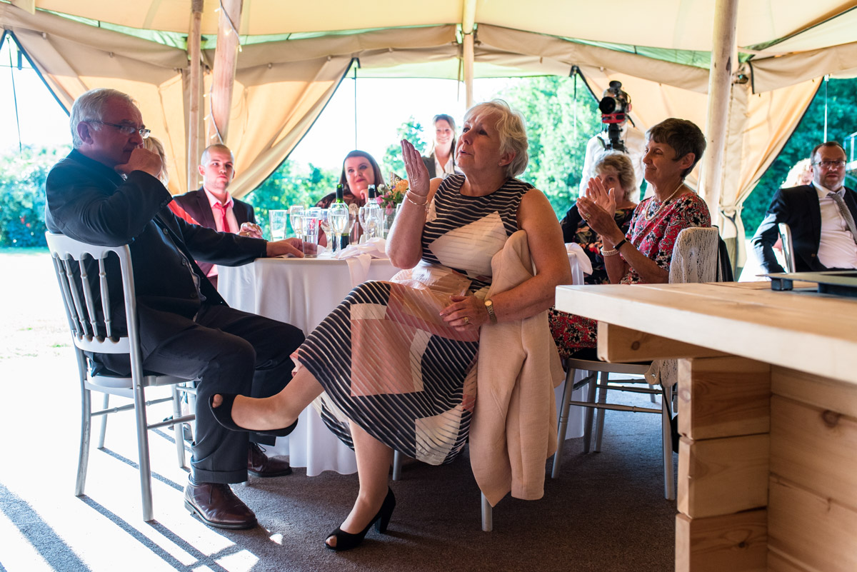 Photograph of wedding guest during speeches at Martin and Debbies wedding in Kent