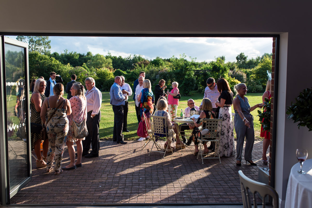 Photograph of the guests outside the barn at debbie and Martins wedding