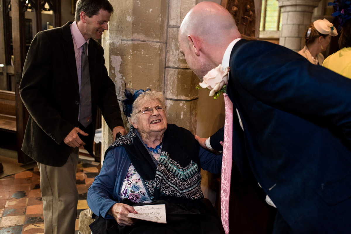 Tom is photographed with his gran before his church wedding ceremony