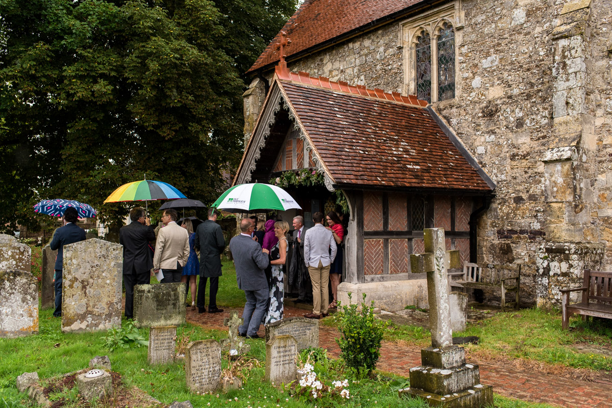 Photograph of wedding guests outside east sussex church