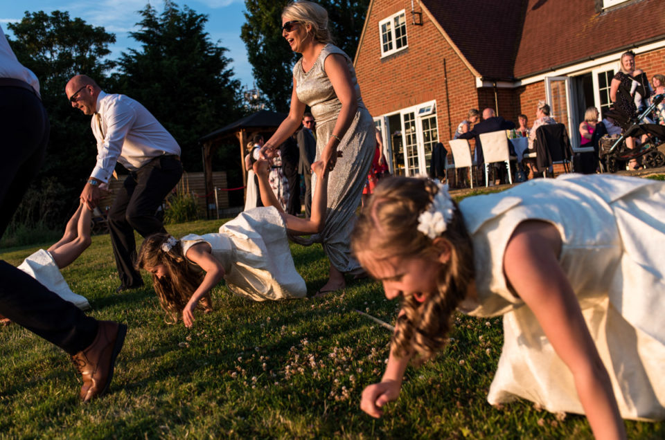 Photographs of wheel barrow racing at Crescent turner Hotel wedding