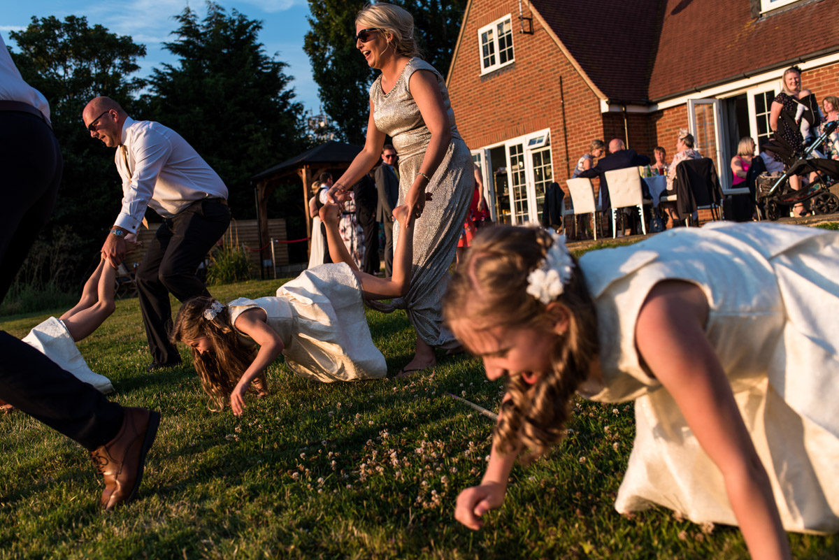 Photographs of wheel barrow racing at Crescent turner Hotel wedding